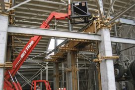 Concrete Hopper unloading concrete with an extendable forklift